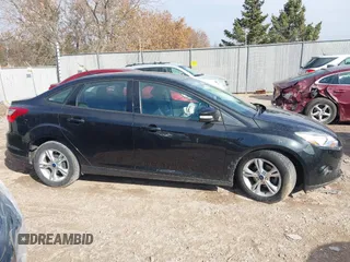 2013 Ford Focus SE z VIN 1FADP3F28DL312357, wystawiony jako IAAI lot #41798311 z przebiegiem 98 280 mil mil oraz . Historia ofert i sprzedaży dostępna na DreamBid. Obrazek 13.