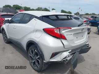 2022 Toyota C-HR XLE z VIN NMTKHMBX2NR144638, wystawiony jako IAAI lot #42063325 z przebiegiem 22 823 mil mil oraz . Historia ofert i sprzedaży dostępna na DreamBid. Obrazek 3.