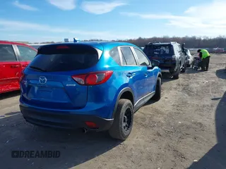 2013 Mazda CX-5 Grand Touring with VIN JM3KE4DE1D0147934, listed as a IAAI auction lot 41869973 with 164,345 mi miles. Bid and sale history available at carsss.com. Image 4.