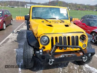 2013 Jeep Wrangler Unlimited Sport z VIN 1C4BJWDG6DL544197, wystawiony jako IAAI lot #41968556 z przebiegiem 121 101 mil mil oraz . Historia ofert i sprzedaży dostępna na DreamBid. Obrazek 13.