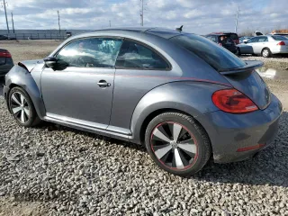 2012 Volkswagen Beetle 2.0T Turbo PZEV with VIN 3VW4A7AT6CM634721, listed as a Copart auction lot 48124045 with 115,515 mi miles and Salvage Title. Bid and sale history available at carsss.com. Image 2.