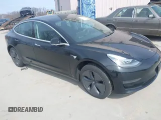 2020 Tesla Model 3 Standard Range Plus with VIN 5YJ3E1EAXLF643807, listed as a IAAI auction lot 41789406 with 49,256 mi miles. Bid and sale history available at carsss.com. Image 1.