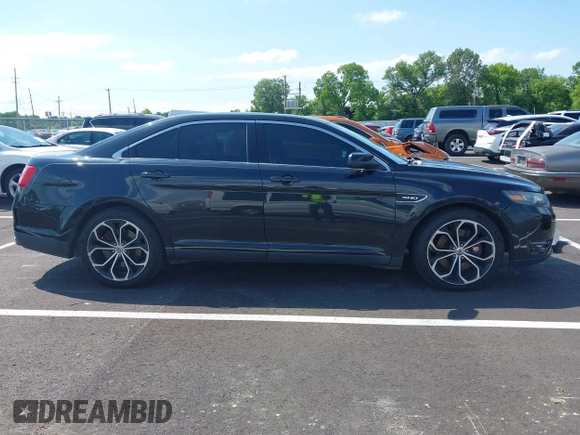 2013 Ford Taurus SHO z VIN 1FAHP2KT1DG135962, wystawiony jako IAAI lot #42449604 z przebiegiem 138 921 mil mil oraz . Historia ofert i sprzedaży dostępna na DreamBid. Obrazek 13.