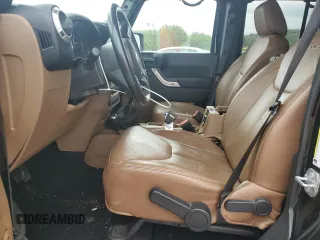 2017 Jeep Wrangler Unlimited Sahara with VIN 1C4BJWEG9HL633296, listed as a Copart auction lot 61387685 with 74,035 mi miles and Salvage title. Bid and sale history available at DreamBid. Image 7.