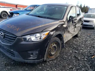 2016 Mazda CX-5 Touring z VIN JM3KE4CY4G0892354, wystawiony jako Copart lot #52349235 z przebiegiem Nie podano mil oraz Szkoda całkowita • Salvage title. Historia ofert i sprzedaży dostępna na DreamBid. Obrazek 1.