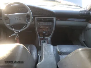 1995 Audi A6 z VIN WAUGA84A2SN055887, wystawiony jako Copart lot #85212394 z przebiegiem 254 307 mil mil oraz Tytuł czysty. Historia ofert i sprzedaży dostępna na DreamBid. Obrazek 8.