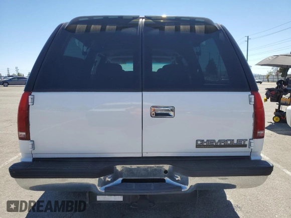 1999 Chevrolet Suburban with VIN 3GNEC16R0XG164600, listed as a Copart auction lot 49516445 with 105,747 mi miles and Salvage Title. Bid and sale history available at carsss.com. Image 6.