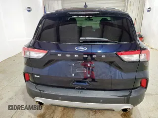 2021 Ford Escape SE z VIN 1FMCU0G67MUA73517, wystawiony jako Copart lot #58307575 z przebiegiem 122 216 mil mil oraz Czysty tytuł • Clean title. Historia ofert i sprzedaży dostępna na DreamBid. Obrazek 6.