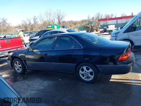 1997 Lexus ES 300 Luxury Sport Sdn with VIN JT8BF22GXV5003056, listed as a IAAI auction lot 41806886 with 130,063 mi miles. Bid and sale history available at carsss.com. Image 14.