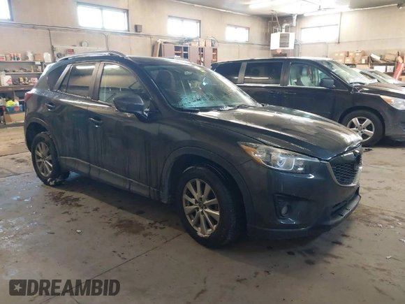 2015 Mazda CX-5 Touring with VIN JM3KE2CY2F0458114, listed as a IAAI auction lot 41545493 with 138,061 mi miles. Bid and sale history available at carsss.com. Image 1.