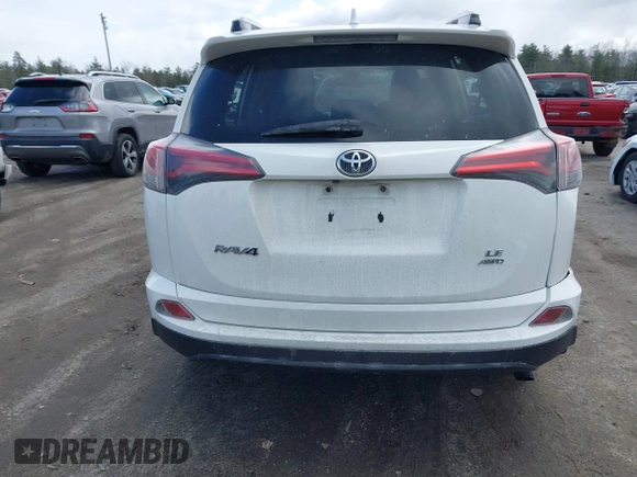 2018 Toyota RAV4 LE with VIN JTMBFREV5JJ738405, listed as a IAAI auction lot 41956145 with 100,593 mi miles and . Bid and sale history available at DreamBid. Image 17.