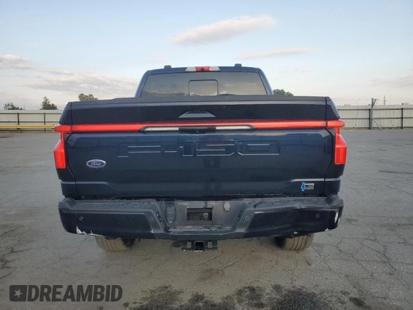 2023 Ford F-150 Lightning Pro with VIN 1FTVW1EV1PWG16263, listed as a Copart auction lot 54439535 with 12,023 mi miles and Salvage Title. Bid and sale history available at DreamBid. Image 6.