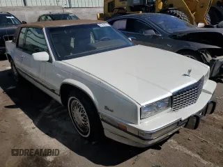 1991 Cadillac Eldorado z VIN 1G6EL13B2MU602660, wystawiony jako Copart lot #67365674 z przebiegiem 108 880 mil mil oraz Szkody całkowita. Historia ofert i sprzedaży dostępna na DreamBid. Obrazek 4.
