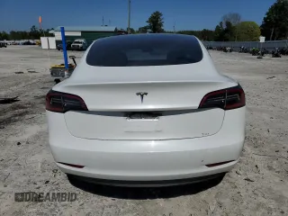 2023 Tesla Model 3 with VIN 5YJ3E1EA9PF558088, listed as a Copart auction lot 52228465 with 63,204 mi miles and Salvage title. Bid and sale history available at DreamBid. Image 6.