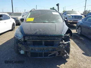 2018 Ford Escape SE z VIN 1FMCU9GD3JUC75754, wystawiony jako IAAI lot #41761965 z przebiegiem 101 771 mil mil oraz . Historia ofert i sprzedaży dostępna na DreamBid. Obrazek 12.