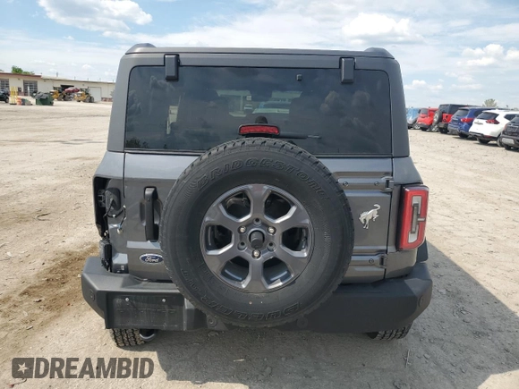 2023 Ford Bronco with VIN 1FMEE5BP3PLC01720, listed as a Copart auction lot 56186505 with 14,229 mi miles and Salvage title. Bid and sale history available at DreamBid. Image 6.