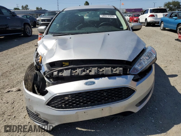 2018 Ford Focus SE with VIN 1FADP3F25JL324753, listed as a Copart auction lot 58624995 with 129,127 mi miles and Salvage title. Bid and sale history available at DreamBid. Image 5.