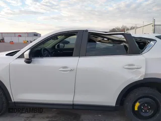 2019 Mazda CX-5 Sport with VIN JM3KFABMXK1655302, listed as a IAAI auction lot 41901293 with 140,369 mi miles and . Bid and sale history available at DreamBid. Image 14.