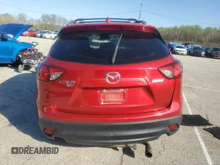 2014 Mazda CX-5 Grand Touring with VIN JM3KE4DY9E0419111, listed as a Copart auction lot 52250315 with 130,003 mi miles and Salvage Title. Bid and sale history available at DreamBid. Image 6.