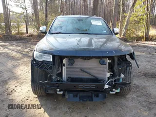 2015 Jeep Grand Cherokee Overland with VIN 1C4RJECGXFC957530, listed as a IAAI auction lot 41633522 with 168,258 mi miles and . Bid and sale history available at DreamBid. Image 6.
