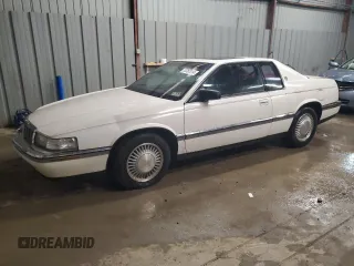 1992 Cadillac Eldorado z VIN 1G6EL13B8NU614555, wystawiony jako Copart lot #73767514 z przebiegiem 88 448 mil mil oraz Tytuł czysty. Historia ofert i sprzedaży dostępna na DreamBid. Obrazek 1.
