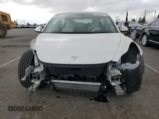 2021 Tesla Model 3 Standard Range Plus with VIN 5YJ3E1EA6MF066064, listed as a Copart auction lot 54063625 with 27,424 mi miles and Salvage Title. Bid and sale history available at DreamBid. Image 5.
