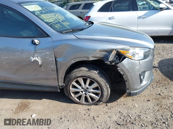2014 Mazda CX-5 Touring with VIN JM3KE4CY0E0302583, listed as a IAAI auction lot 41947735 with 122,077 mi miles. Bid and sale history available at carsss.com. Image 6.