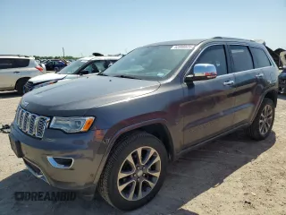 2017 Jeep Grand Cherokee Overland with VIN 1C4RJFCGXHC941983, listed as a Copart auction lot 52008825 with 65,776 mi miles and Salvage Title. Bid and sale history available at carsss.com. Image 1.