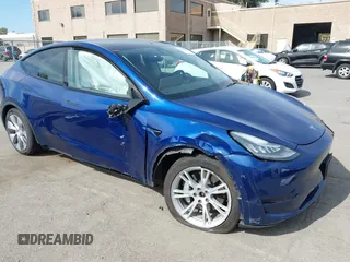2020 Tesla Model Y Long Range with VIN 5YJYGDEE1LF006227, listed as a IAAI auction lot 42100833 with 49,761 mi miles and . Bid and sale history available at DreamBid. Image 1.