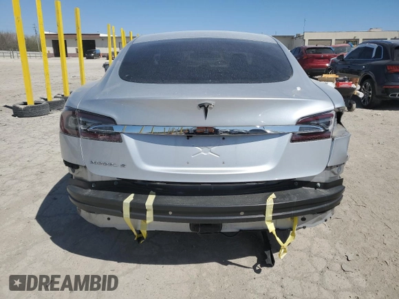 2013 Tesla Model S с VIN 5YJSA1CN5DFP05936, выставлен на аукционе Copart как лот 51831795 с пробегом Не указан миль и Списание • Salvage title. История ставок и продаж доступна на DreamBid. Изображение 6.