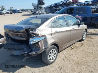 2012 Hyundai Accent GLS with VIN KMHCT4AE4CU097413, listed as a IAAI auction lot 42024571 with 120,672 mi miles. Bid and sale history available at carsss.com. Image 4.