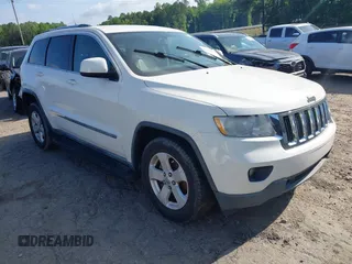 2011 Jeep Grand Cherokee Laredo with VIN 1J4RS4GGXBC517068, listed as a IAAI auction lot 42173780 with 170,688 mi miles and . Bid and sale history available at DreamBid. Image 1.