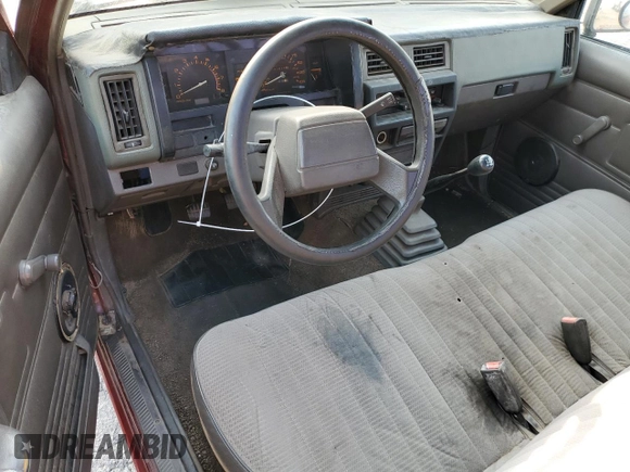 1989 Nissan Hardbody z VIN 1N6ND11S0KC342434, wystawiony jako Copart lot #71089274 z przebiegiem 300 076 mil mil oraz Szkody całkowita. Historia ofert i sprzedaży dostępna na DreamBid. Obrazek 8.