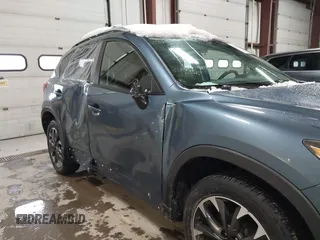 2016 Mazda CX-5 Grand Touring z VIN JM3KE4DY9G0714468, wystawiony jako IAAI lot #41860956 z przebiegiem 114 481 mil mil oraz . Historia ofert i sprzedaży dostępna na DreamBid. Obrazek 6.