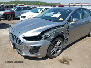 2020 Ford Fusion SEL with VIN 3FA6P0CDXLR196124, listed as a IAAI auction lot 42244231 with 99,306 mi miles and . Bid and sale history available at DreamBid. Image 6.