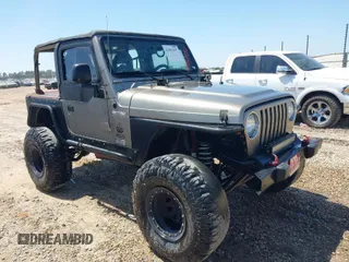 2004 Jeep Wrangler X with VIN 1J4FA39S04P717339, listed as a IAAI auction lot 41982497 with 168,629 mi miles. Bid and sale history available at carsss.com. Image 1.