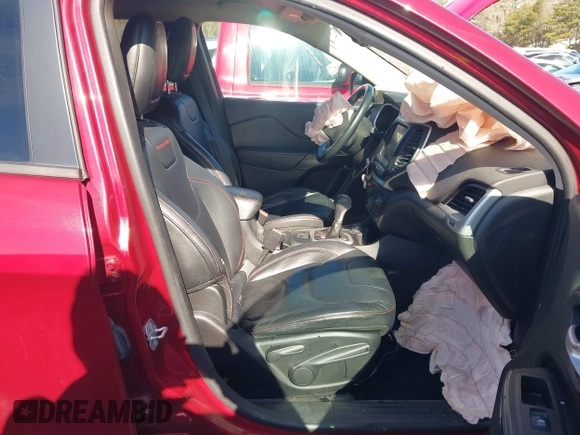 2014 Jeep Cherokee Trailhawk with VIN 1C4PJMBS0EW257133, listed as a IAAI auction lot 41446095 with 82,285 mi miles and . Bid and sale history available at DreamBid. Image 5.