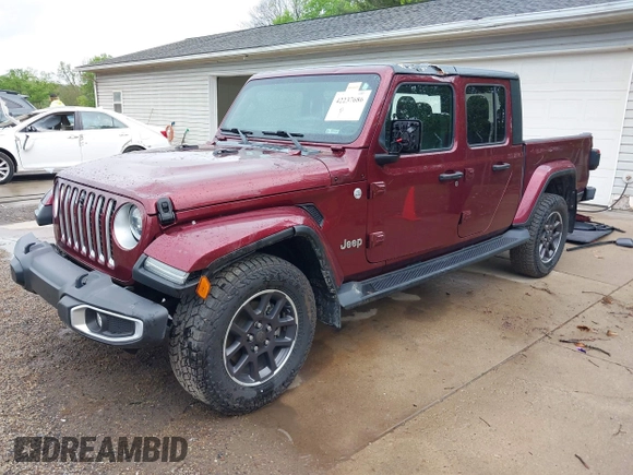 2021 Jeep Gladiator Overland with VIN 1C6HJTFGXML555622, listed as a IAAI auction lot 42237686 with 62,358 mi miles and . Bid and sale history available at DreamBid. Image 2.