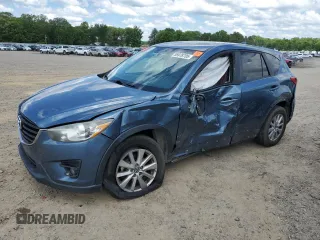 2016 Mazda CX-5 Touring z VIN JM3KE2CY1G0636967, wystawiony jako Copart lot #55978705 z przebiegiem 167 854 mil mil oraz Szkoda całkowita • Salvage title. Historia ofert i sprzedaży dostępna na DreamBid. Obrazek 1.