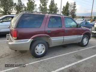 2000 GMC Jimmy SL with VIN 1GKCS13WXY2180539, listed as a Copart auction lot 89411665 with 167,674 mi miles and Salvage Title. Bid and sale history available at carsss.com. Image 3.