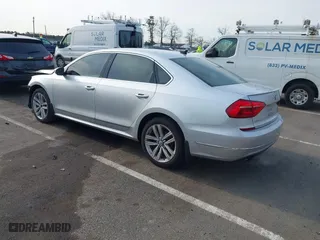 2016 Volkswagen Passat 1.8T SEL with VIN 1VWCT7A3XGC018484, listed as a IAAI auction lot 41763388 with 123,484 mi miles. Bid and sale history available at carsss.com. Image 3.