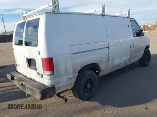 2001 Ford Econoline Cargo Commercial with VIN 1FTNE24L21HA95140, listed as a IAAI auction lot 41490323 with 330,136 mi miles and . Bid and sale history available at carsss.com. Image 4.