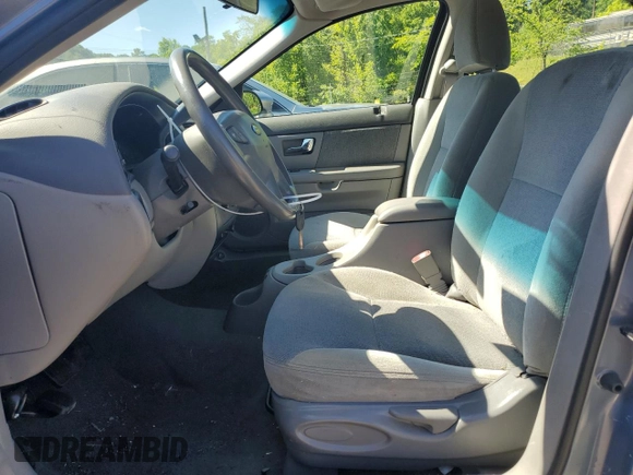 2001 Ford Taurus SE with VIN 1FAFP53U61A161763, listed as a Copart auction lot 43317165 with 64,025 mi miles and Salvage title. Bid and sale history available at DreamBid. Image 7.