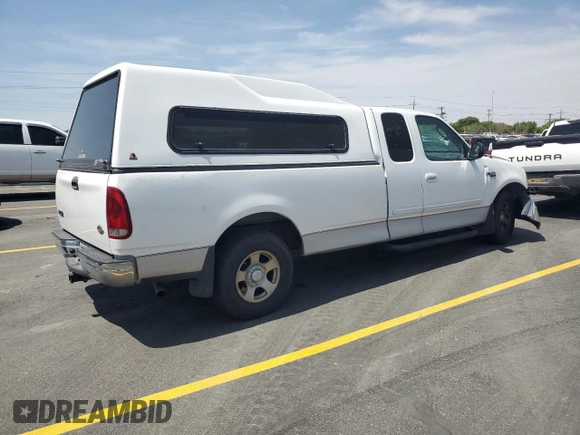 2003 Ford F-150 XL with VIN 2FTRX17L23CA17128, listed as a Copart auction lot 60144965 with 121,055 mi miles and Salvage title. Bid and sale history available at DreamBid. Image 3.