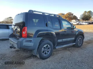 2014 Nissan Xterra X with VIN 5N1AN0NW9EN812437, listed as a Copart auction lot 83905504 with 118,805 mi miles and Salvage Title. Bid and sale history available at DreamBid. Image 3.