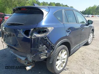 2014 Mazda CX-5 Grand Touring with VIN JM3KE4DYXE0342720, listed as a IAAI auction lot 42026388 with 114,072 mi miles and . Bid and sale history available at carsss.com. Image 4.