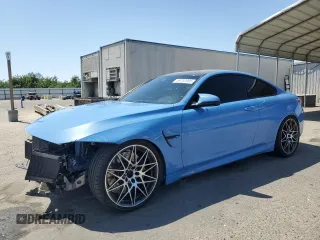 2018 BMW M4 with VIN WBS4Y9C5XJAA85555, listed as a Copart auction lot 59702895 with 57,282 mi miles and Salvage title. Bid and sale history available at DreamBid. Image 1.