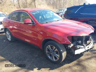 2015 BMW X4 xDrive28i with VIN 5UXXW3C52F0F89035, listed as a IAAI auction lot 41834694 with 83,798 mi miles. Bid and sale history available at carsss.com. Image 1.