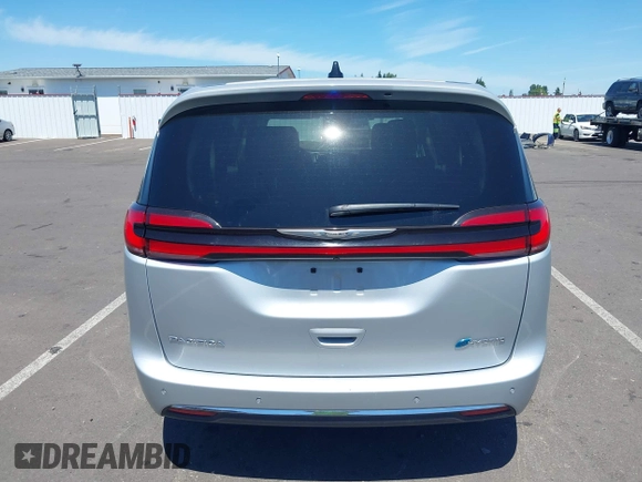 2023 Chrysler Pacifica Hybrid Touring L with VIN 2C4RC1L75PR614460, listed as a IAAI auction lot 42628545 with 68,668 mi miles and . Bid and sale history available at DreamBid. Image 16.