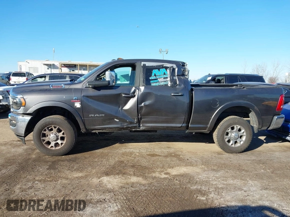 2021 Ram 2500 Laramie z VIN 3C6UR5FL7MG629012, wystawiony jako IAAI lot #41369353 z przebiegiem 168 099 mil mil oraz . Historia ofert i sprzedaży dostępna na DreamBid. Obrazek 14.